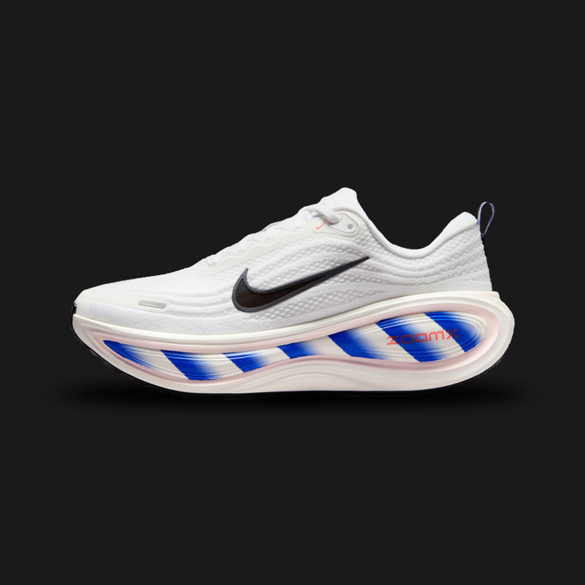 Nike Vomero Plus shoes in White, Racer Blue, Bright Crimson, and Black (II5257-100). Features a heavily layered breathable white mesh upper with synthetic overlays and a structural midfoot cage. Includes a plush Cushlon foam midsole with Zoom Air cushioning, accented by bold Racer Blue and Bright Crimson details. Luxuntique offers 100% authentic Nike in Sri Lanka.
