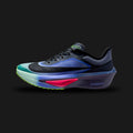 Nike Zoom Fly 6 Glam running shoes in Dark Obsidian, Racer Blue, Emerald Rise, and Black (IO9572-400). Features a dual-layer engineered mesh upper with a transparent Dark Obsidian overlay. Includes a towering 40mm dual-foam midsole with a top layer of ZoomX, an embedded full-length carbon-fiber Flyplate, and vibrant Emerald Rise accents. Luxuntique offers 100% authentic Nike in Sri Lanka.