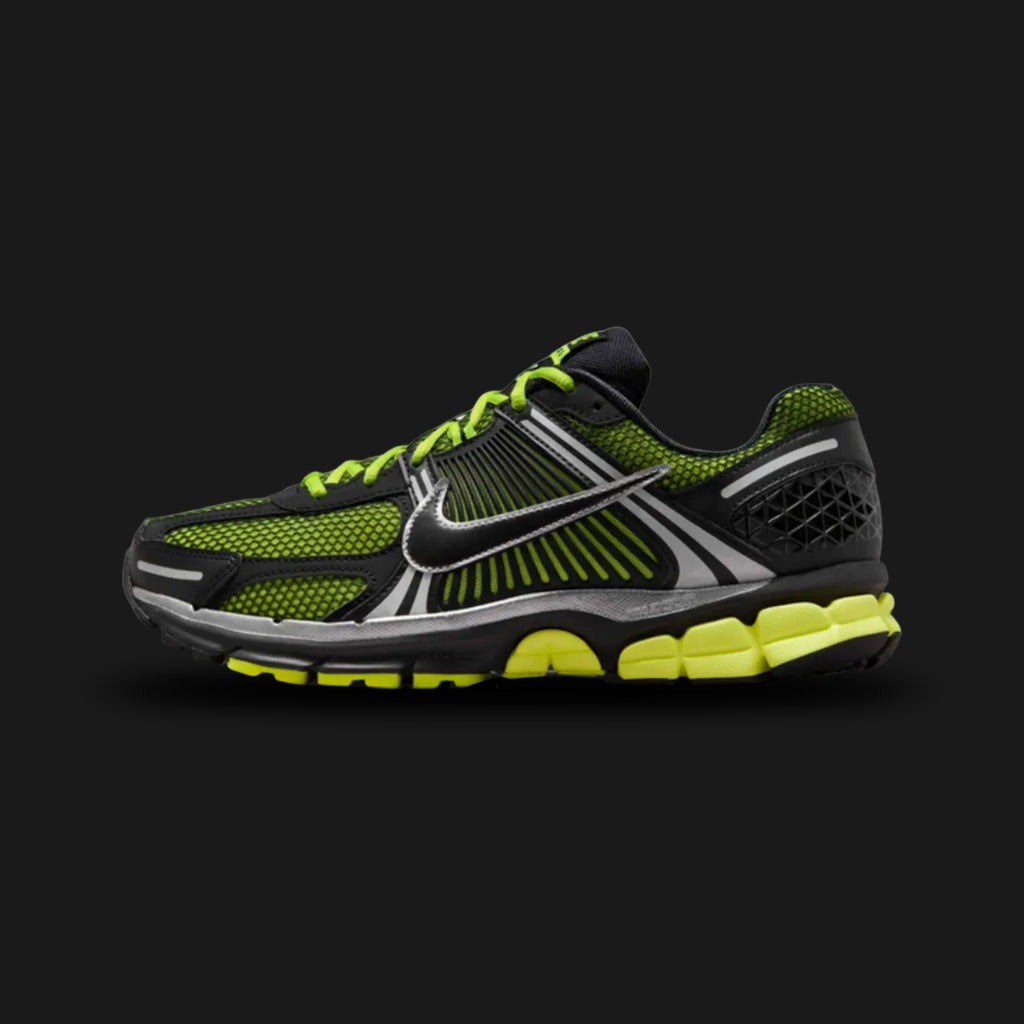 Nike Zoom Vomero 5 retro running shoes in Lemon Venom, White, and Black (Design Code: FB9149-702). Featuring a highly breathable Lemon Venom mesh upper heavily layered with synthetic leather and signature plastic side caging. Accented with sharp Black details, reflective 3M highlights, and a crisp White Cushlon foam midsole equipped with responsive Zoom Air cushioning. Luxuntique offers 100% authentic Nike lifestyle sneakers at the lowest price in Sri Lanka.