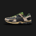 Nike Zoom Vomero 5 shoes in Pale Ivory, Smoke Grey, Chlorophyll, and Off-Noir (HF1553-102). Features a breathable Smoke Grey mesh base with premium Pale Ivory suede overlays and a structural TPU midfoot cage. Accented by vibrant Chlorophyll green details on the laces and lining. Includes a Cushlon foam midsole with Zoom Air cushioning and an Off-Noir rubber outsole. Luxuntique offers 100% authentic Nike in Sri Lanka.