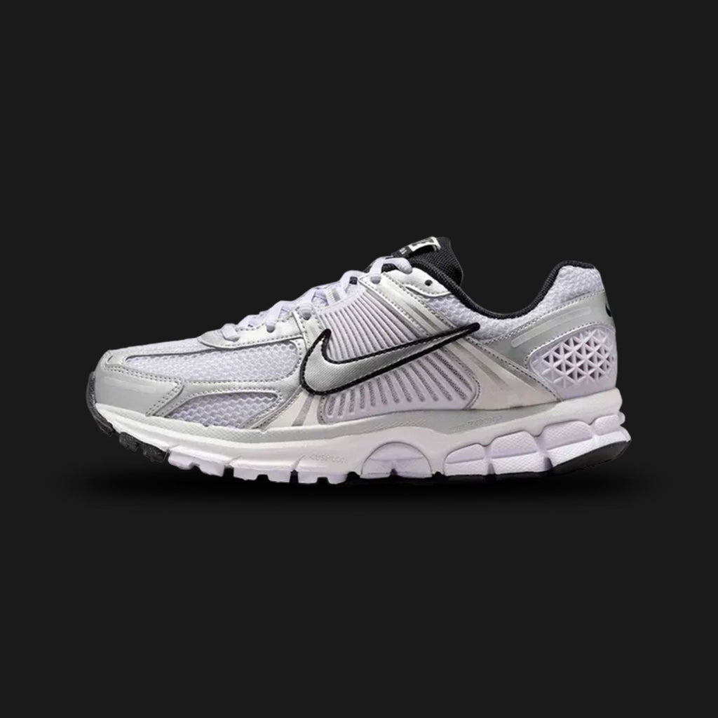 White Nike Zoom Vomero 5 running shoe with black accents (Design code: NKIB7253-500). Luxuntique offers 100% authentic Nike Zoom footwear at the lowest prices in Sri Lanka.