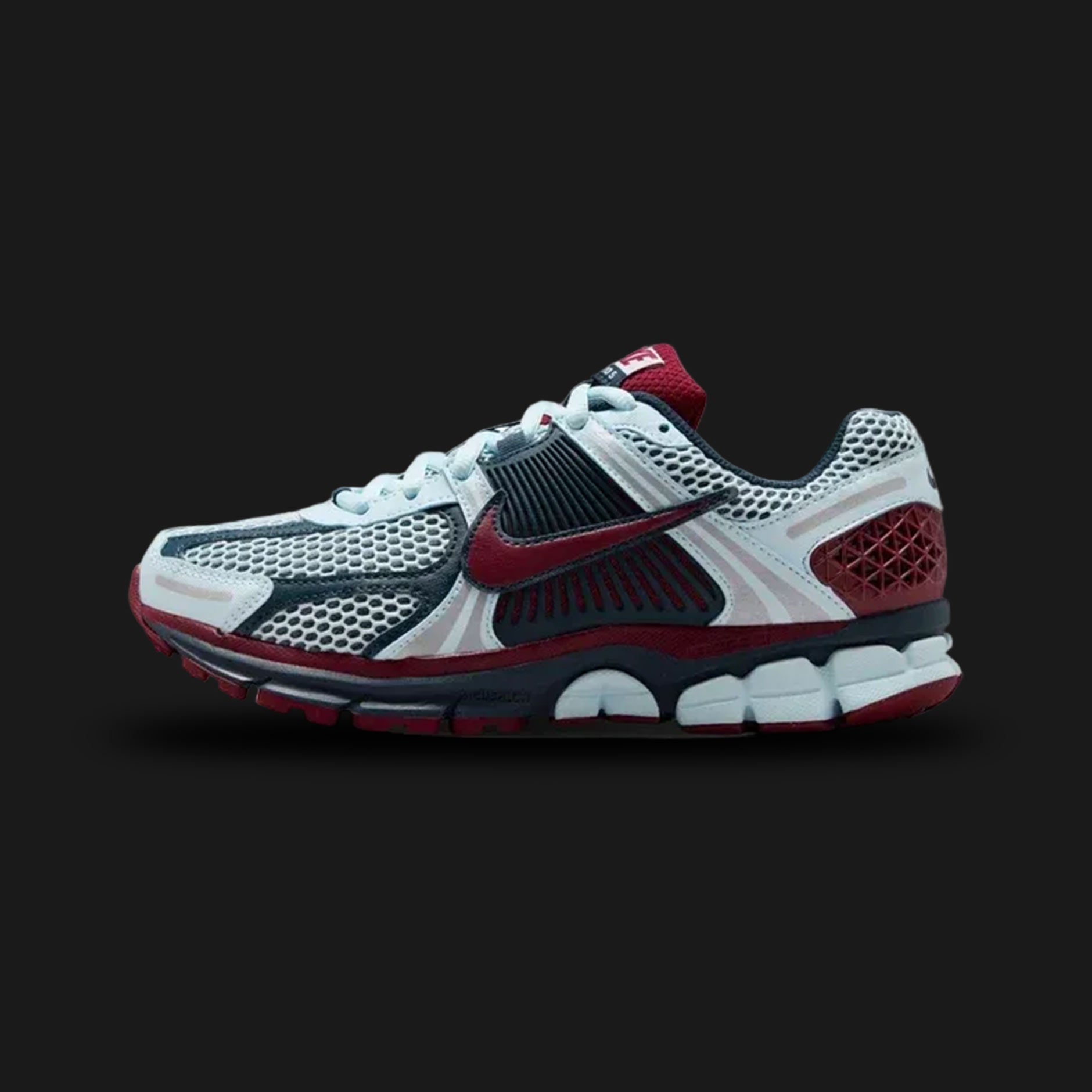 White, red, and blue Nike Zoom Vomero 5 athletic shoe (Design code: NKIB7700-400). Luxuntique offers 100% authentic Nike Zoom Vomero sneakers at the lowest prices in Sri Lanka.