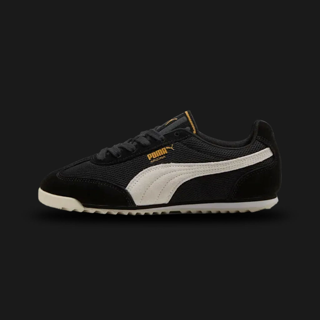 Puma Arizona women's sneakers in PUMA Black and Alpine Snow (Design Code: 403782-01). Featuring a classic terrace-inspired silhouette with a premium suede upper, contrast Alpine Snow Formstrip, and a durable rubber outsole for everyday comfort. Luxuntique offers 100% authentic Puma lifestyle sneakers at the lowest price in Sri Lanka.