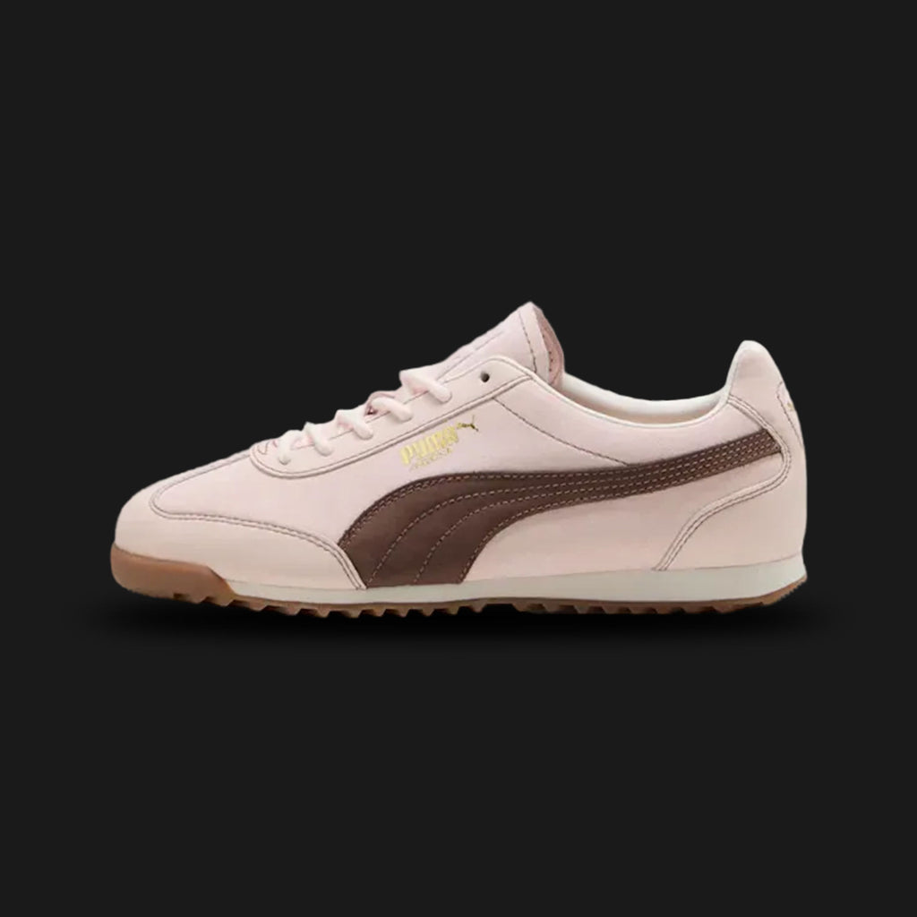 PUMA Arizona Wine Club women's sneakers in Jasmine Flower, Flat Bronze, and PUMA Gold (Design Code: 403783-01). Featuring a premium suede and leather upper in cream tones with bronze and gold metallic accents. Part of the exclusive Wine Club collection, these sneakers offer a slim 70s retro silhouette and a low-profile rubber outsole. Luxuntique offers 100% authentic PUMA lifestyle sneakers at the lowest price in Sri Lanka.
