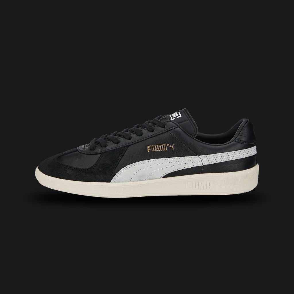Puma Army Trainer sneakers in Puma Black and Pristine (386607_02). Features a classic German Army Trainer vintage silhouette with a premium leather upper, soft suede T-toe overlay, and a low-profile gum rubber outsole. Luxuntique guarantees 100% authentic footwear in Sri Lanka.