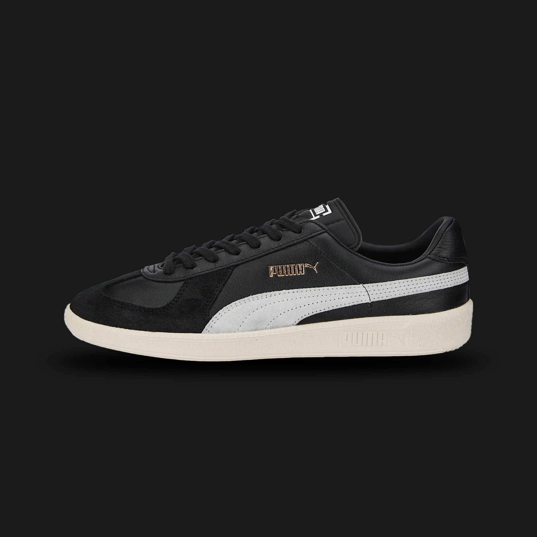 Puma Army Trainer sneakers in Puma Black and Pristine (386607_02). Features a classic German Army Trainer vintage silhouette with a premium leather upper, soft suede T-toe overlay, and a low-profile gum rubber outsole. Luxuntique guarantees 100% authentic footwear in Sri Lanka.