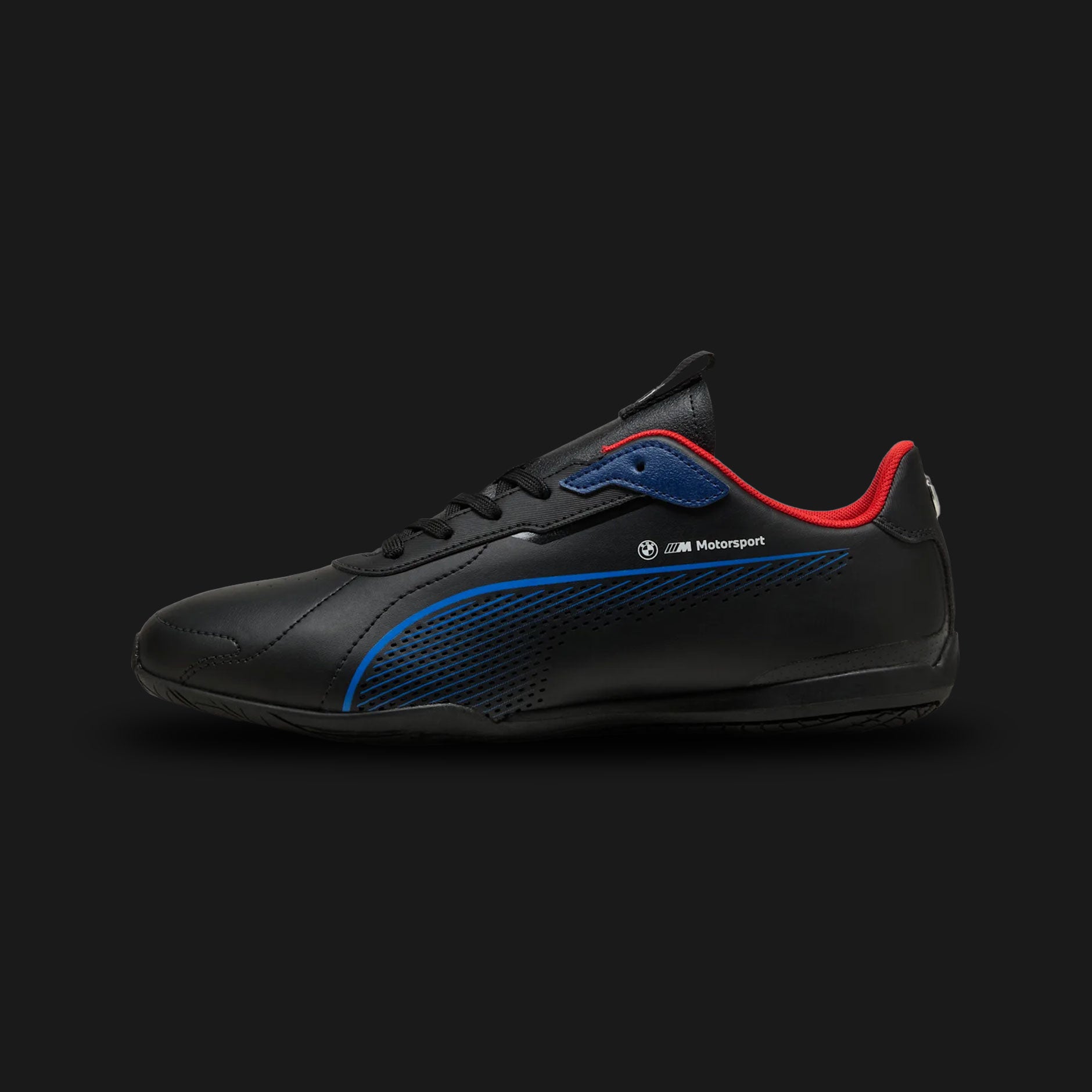 Puma BMW M Motorsport Neo Cat 3.0 unisex sneakers in Puma Black and Pop Red (309087_01). Features a sleek, low-profile synthetic leather upper inspired by high-performance driving shoes. Includes the official BMW M Motorsport branding, striking Pop Red racing accents, a comfortable cushioned footbed, and a thin, tactile rubber outsole designed for pedal control and street-ready style. Luxuntique guarantees 100% authentic Puma footwear in Sri Lanka.
