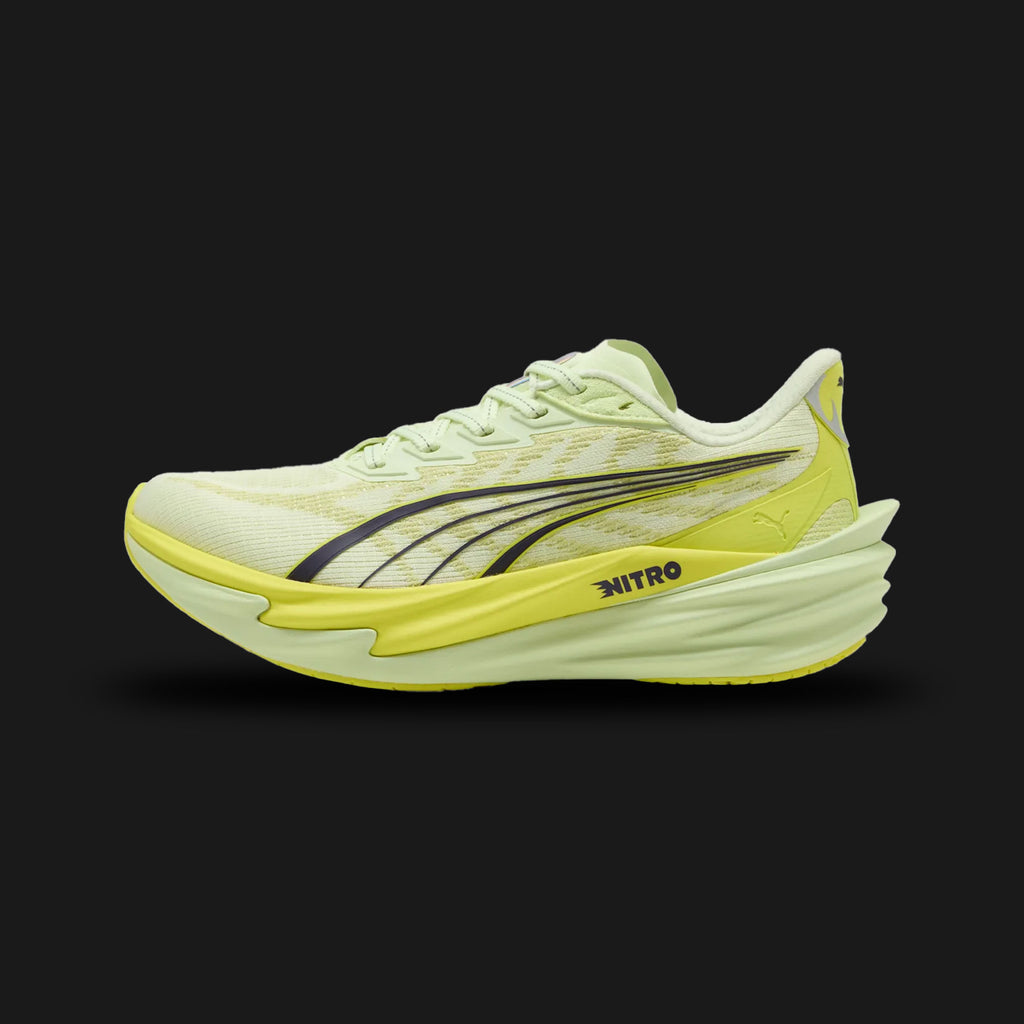 Puma Deviate NITRO 4 women's running shoes in vibrant Apple Spritz and Lux Lime (312124_04). Features a breathable engineered mesh upper, a dual-layer NITRO foam midsole for elite cushioning, a carbon-composite PWRPLATE for maximum energy return, and a durable PUMAGRIP rubber outsole. Luxuntique guarantees 100% authentic Puma footwear in Sri Lanka.