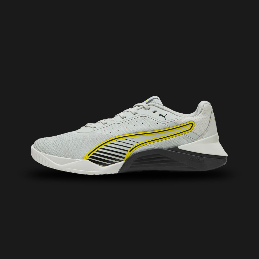 Puma Fuse 4.0 unisex sneakers in Cool Light Gray, Puma Black, and Lux Lime (311733_08). Features a high-performance training silhouette with a durable, breathable mesh upper and a supportive TPU heel clip. Includes a responsive PUMAGRIP rubber outsole for multidirectional traction, striking Lux Lime accents for visibility, and a stable, low-to-the-ground construction ideal for gym workouts and cross-training. Luxuntique guarantees 100% authentic Puma footwear in Sri Lanka.