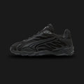 PUMA Inhale Tech Street X unisex sneakers in Puma Black and Puma Silver (Design Code: 402869-01). Featuring a breathable mesh upper with signature "flame" synthetic overlays in metallic silver. Includes a cushioned midsole for Y2K-era comfort and a durable rubber outsole for traction. Luxuntique offers 100% authentic PUMA lifestyle sneakers at the lowest price in Sri Lanka.