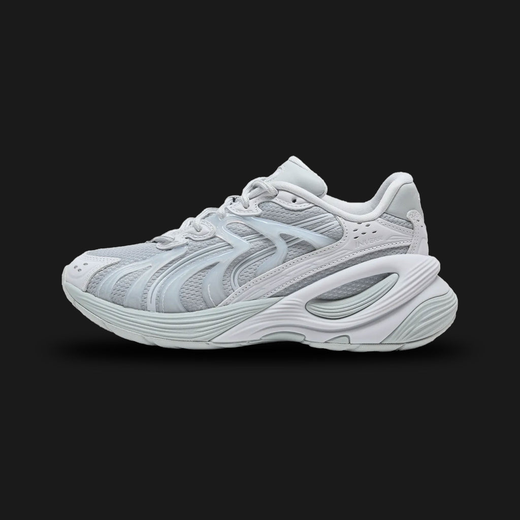 Puma Inverse Premium women's sneakers in Platinum Gray, Silver Mist, and Cool Mid Gray (401756_02). Features a sophisticated, multi-layered tech-runner silhouette blending premium leather, suede overlays, and breathable mesh. Includes striking Silver Mist metallic accents, a chunky sculpted midsole for modern styling, and a durable rubber outsole. Luxuntique guarantees 100% authentic Puma footwear in Sri Lanka.