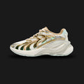 Puma Inverse Shimmer women's sneakers in Warm White and Archive Gold (402972_01). Features a layered Y2K tech-runner silhouette with a breathable Warm White mesh and synthetic leather upper. Includes highly reflective Archive Gold metallic accents, a chunky sculpted midsole for modern elevated styling, and a durable rubber outsole. Luxuntique guarantees 100% authentic Puma footwear in Sri Lanka.