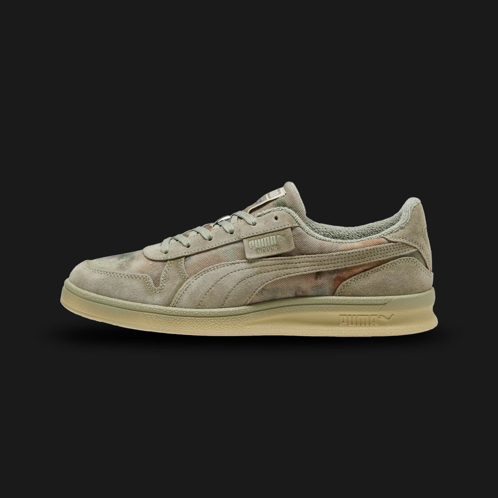 Puma x KidSuper Indoor Distressed unisex sneakers in Lux Army (402378_01). Features a unique, art-inspired design with a distressed "Lux Army" finish that gives it an authentic, worn-in vintage look. Constructed with a premium upper, co-branded detailing, and a flat rubber outsole for stable indoor performance and high-fashion street appeal. Luxuntique guarantees 100% authentic Puma footwear in Sri Lanka.
