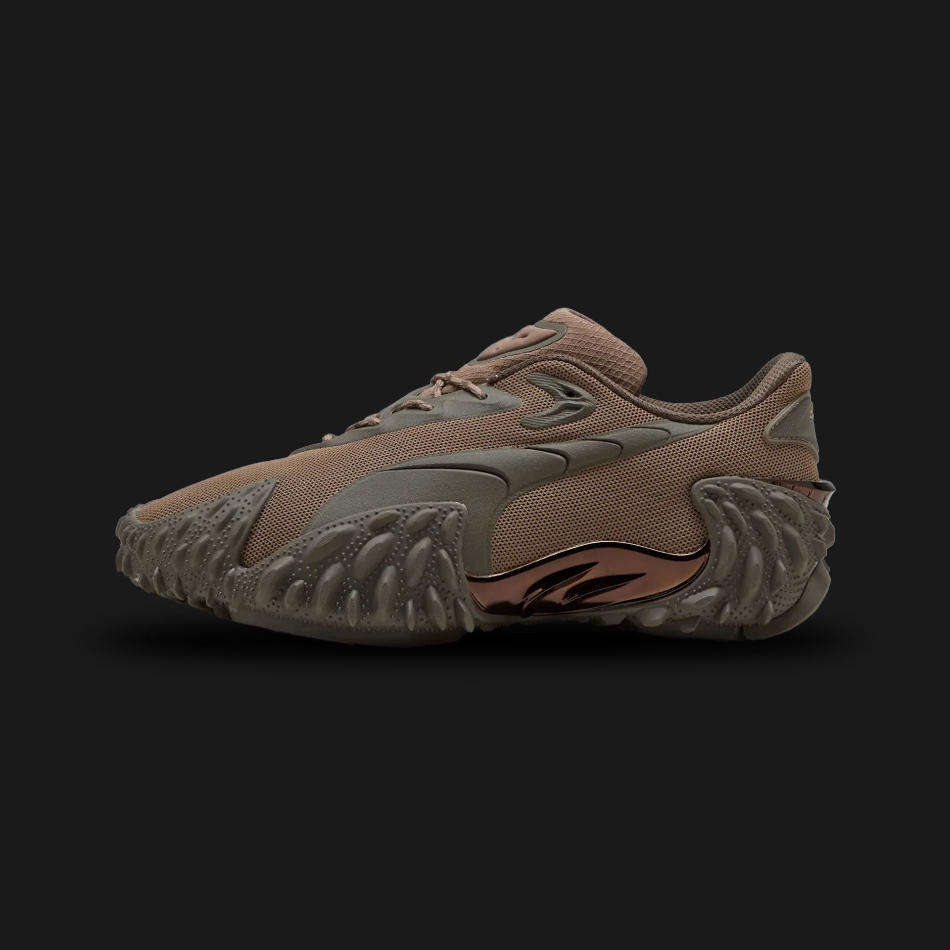 Puma Mostro X Dots unisex sneakers in Totally Taupe and Matte Bronze (406198_06). Features a hybrid avant-garde silhouette with a double-layer mesh base and a bold Matte Bronze PUMA Formstrip. Includes distinctive sculptural design, low-profile shape, and the iconic spiked rubber sole. Luxuntique guarantees 100% authentic Puma footwear in Sri Lanka.