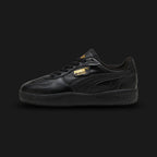 Puma Palermo Moda Leather women's sneakers in clean Puma Black (397738_02). Features a modern, feminine update to the iconic terrace silhouette, showcasing a premium black leather upper with clean structural overlays. Includes the classic Palermo gold-foil branding side-tag, a supportive T-toe construction, and a slightly elevated/stacked platform rubber outsole for everyday urban street comfort. Luxuntique guarantees 100% authentic Puma footwear in Sri Lanka.