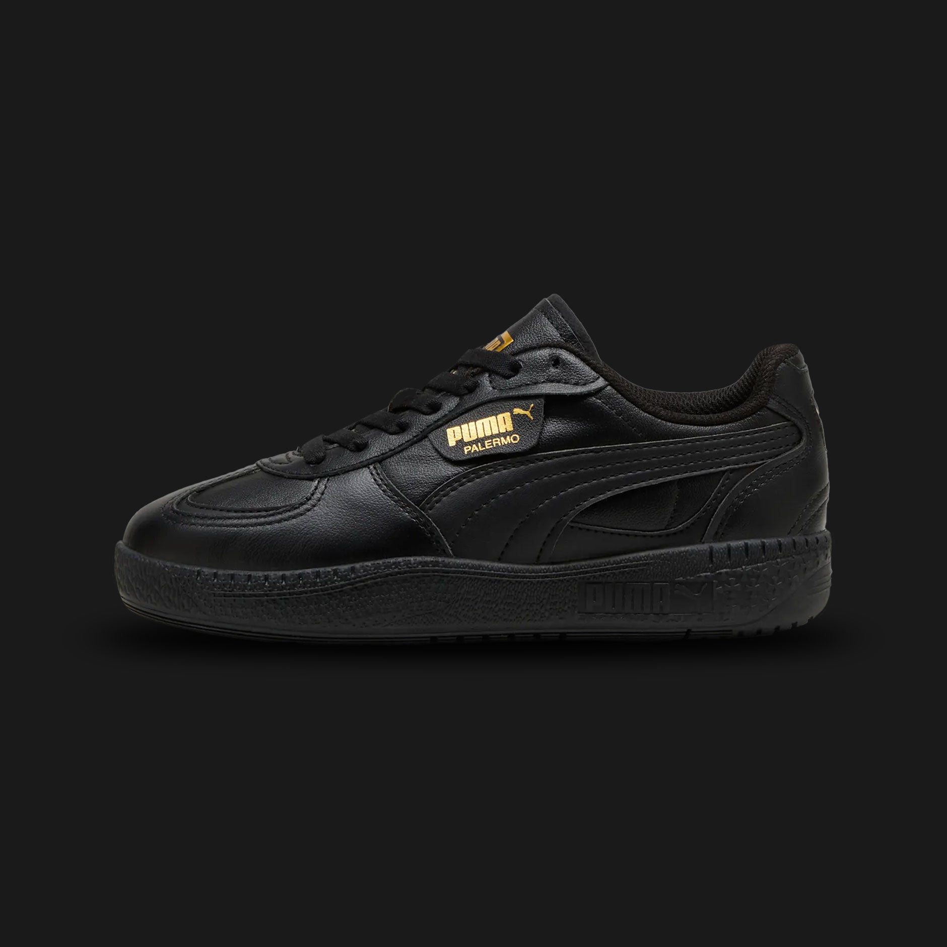 Puma Palermo Moda Leather women's sneakers in clean Puma Black (397738_02). Features a modern, feminine update to the iconic terrace silhouette, showcasing a premium black leather upper with clean structural overlays. Includes the classic Palermo gold-foil branding side-tag, a supportive T-toe construction, and a slightly elevated/stacked platform rubber outsole for everyday urban street comfort. Luxuntique guarantees 100% authentic Puma footwear in Sri Lanka.