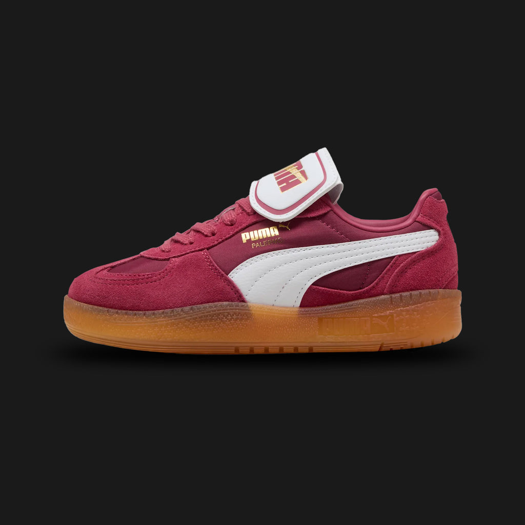 Puma Palermo Moda women's sneakers in Port burgundy and Puma White (401679_02). Features a retro terrace silhouette with a premium Port red suede upper and a distinct, exaggerated fold-over Moda tongue. Includes a crisp White Puma formstrip, classic T-toe construction, and a durable retro rubber outsole. Luxuntique guarantees 100% authentic Puma footwear in Sri Lanka.