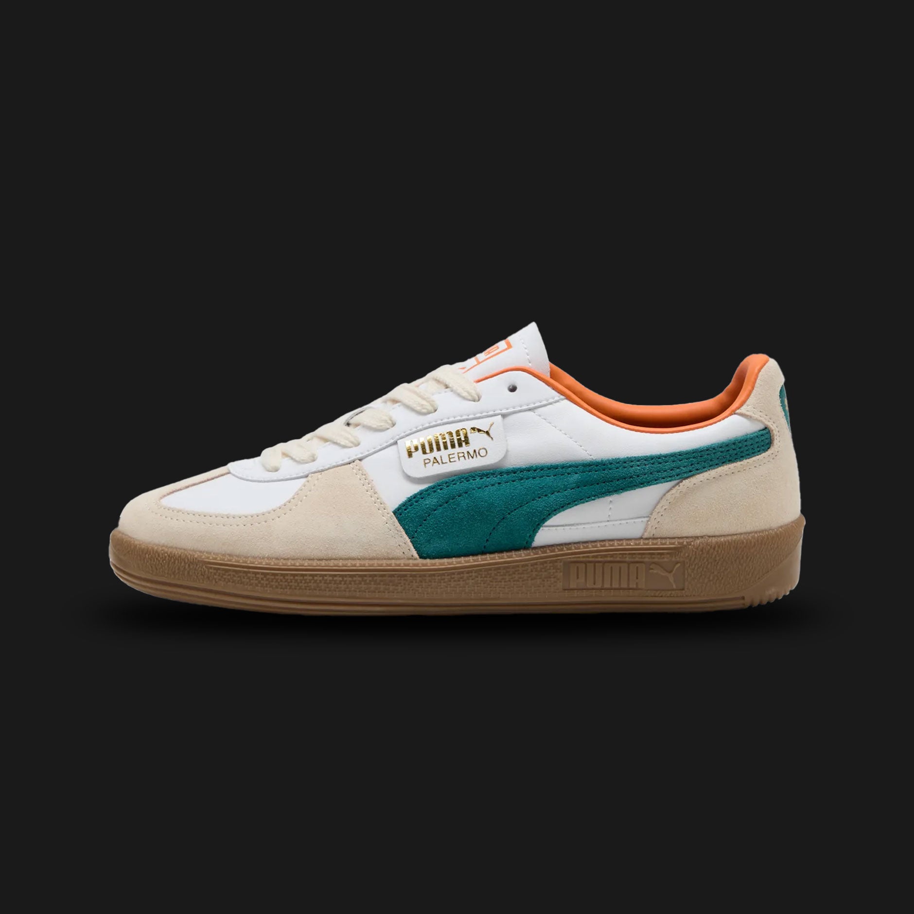 Puma Palermo unisex sneakers in Puma White and Emerald Ice (396464_26). Features a classic terrace silhouette with a premium white leather upper and signature T-toe construction. Includes a vibrant Emerald Ice Puma formstrip, classic gold-foil branding, and a retro Gum rubber sole for authentic vintage style and everyday traction. Luxuntique guarantees 100% authentic Puma footwear in Sri Lanka.