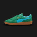 PUMA Palermo Vintage Update Unisex sneakers in Archive Green and Bright Aqua (401364_01). Features a premium forest green suede upper with a teal aqua leather Formstrip and iconic T-toe construction. Gold foil Palermo branding on the lateral flap. Signature gum rubber outsole for an archival terrace look. Luxuntique offers 100% authentic PUMA in Sri Lanka.