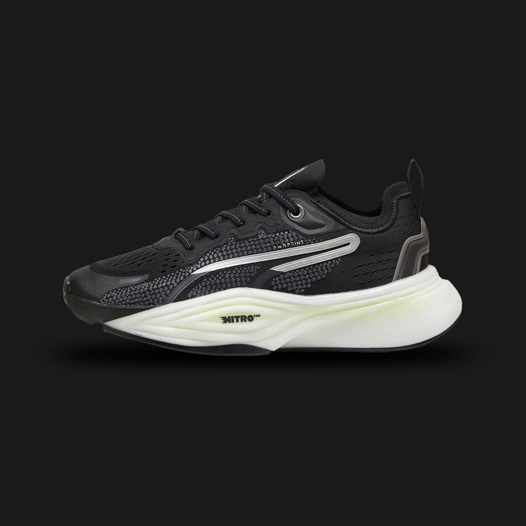 Puma PWR NITRO SQD 2 women's training shoes in Puma Black and Puma White (310147_01). Features a breathable Black engineered mesh upper with a secure heel support system. Includes crisp White Puma branding, a dual-density NITRO SQD foam midsole for lateral stability and explosive cushioning, and a durable PUMAGRIP rubber traction outsole. Luxuntique guarantees 100% authentic Puma footwear in Sri Lanka.