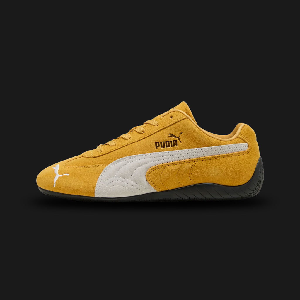 PUMA Speedcat OG Unisex sneakers in Archive Gold and PUMA White (398846_06). Features a vibrant yellow premium suede upper with a crisp white stitched leather Formstrip and metallic gold foil PUMA branding. Iconic low-profile tire-tread rubber outsole and rounded driver's heel. Luxuntique offers 100% authentic PUMA in Sri Lanka.