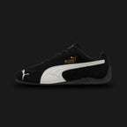 PUMA Speedcat OG Unisex sneakers in PUMA Black and PUMA White (398846_01). Features a premium soft black suede upper with a crisp white stitched leather Formstrip and metallic gold foil PUMA branding. Iconic low-profile tire-tread rubber outsole and rounded driver's heel. Luxuntique offers 100% authentic PUMA in Sri Lanka.