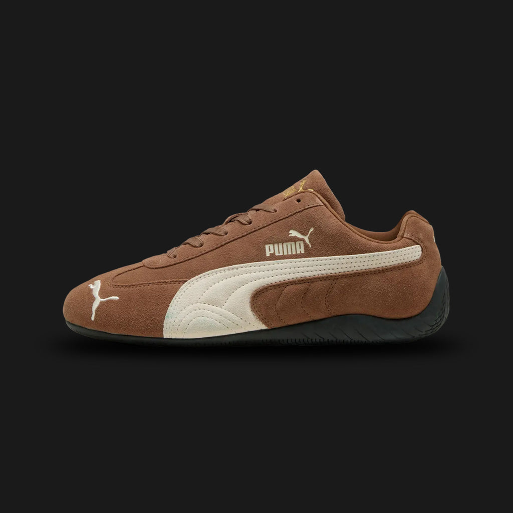 PUMA Speedcat OG Unisex sneakers in Haute Coffee brown and Frosted Ivory (398846_31). Features a premium dark brown suede upper with a creamy off-white Formstrip and metallic gold PUMA branding. Signature low-profile tire-tread rubber outsole and rounded driver's heel. Luxuntique offers 100% authentic PUMA in Sri Lanka.