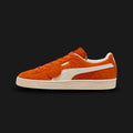 PUMA Suede Charles F. Stead I Unisex sneakers in Orange Glo and PUMA White (403766_02). Features ultra-premium, heavy-nap British suede from the legendary Charles F. Stead tannery. Vibrant orange upper with a crisp white leather Formstrip and metallic gold foil PUMA branding. Finished with a textured white rubber midsole. Luxuntique offers 100% authentic premium PUMA in Sri Lanka.