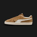 PUMA Suede Charles F. Stead V Unisex sneakers in Honey Butter and PUMA White (403767_03). Features ultra-premium, heavy-nap suede from the legendary Charles F. Stead tannery in Leeds. Rich golden-yellow upper with a crisp white leather Formstrip and metallic gold branding. Classic textured rubber midsole. Luxuntique offers 100% authentic premium PUMA in Sri Lanka.