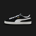 PUMA Suede Classic Unisex sneakers in PUMA Black and PUMA White (399781_01). Features a premium black suede upper with a crisp white leather Formstrip and metallic gold foil PUMA branding. Finished with the signature textured white rubber midsole. A 1968 archival icon. Luxuntique offers 100% authentic PUMA in Sri Lanka.