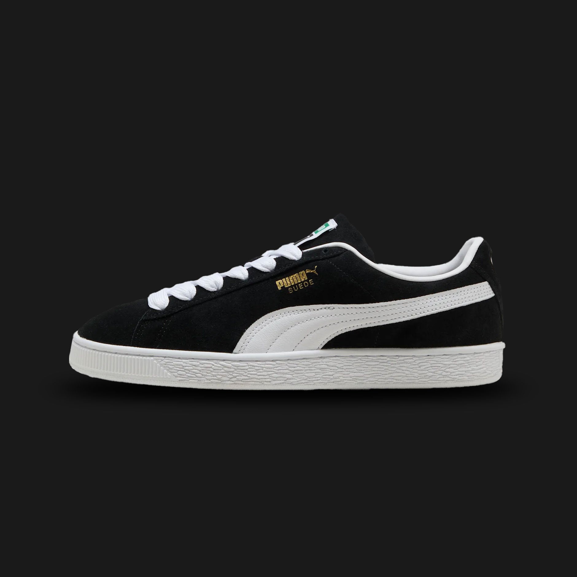 PUMA Suede Classic Unisex sneakers in PUMA Black and PUMA White (399781_01). Features a premium black suede upper with a crisp white leather Formstrip and metallic gold foil PUMA branding. Finished with the signature textured white rubber midsole. A 1968 archival icon. Luxuntique offers 100% authentic PUMA in Sri Lanka.