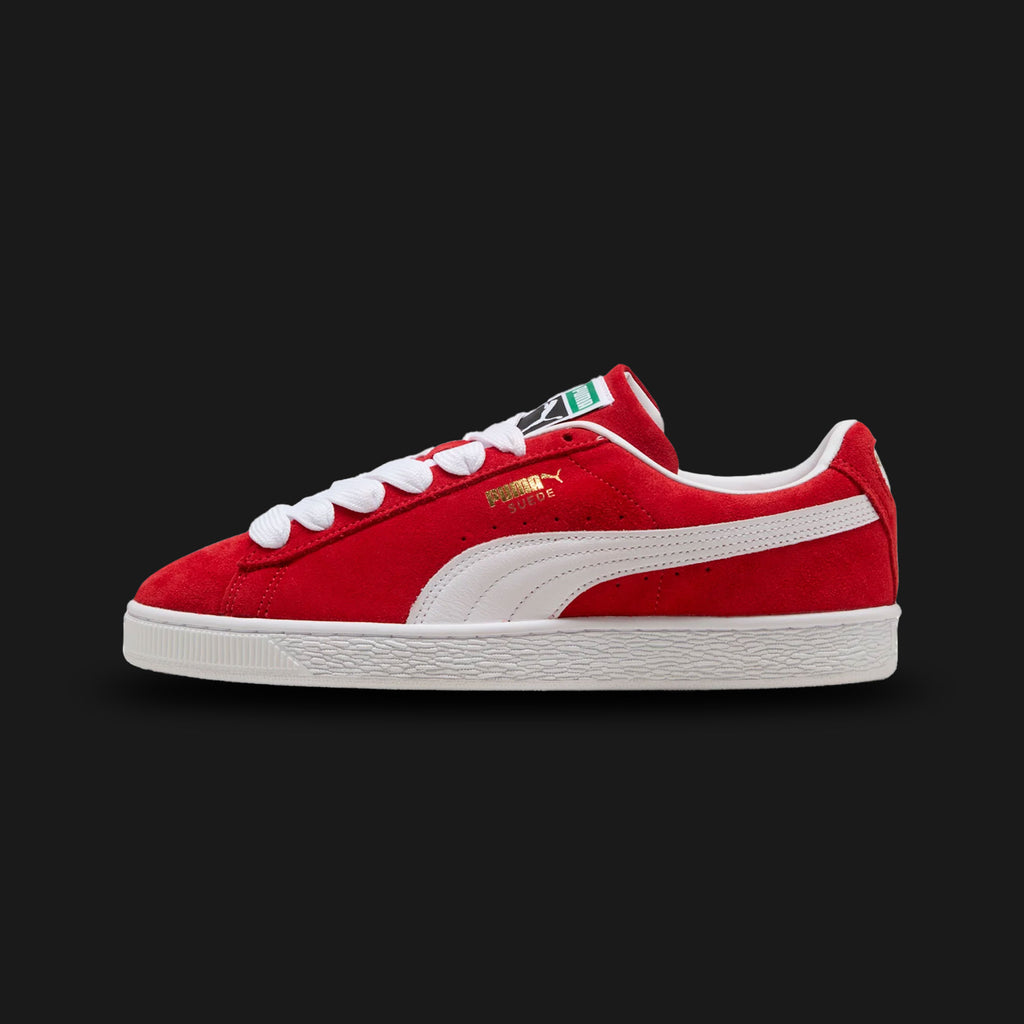 PUMA Suede Classic Unisex sneakers in For All Time Red and PUMA White (399781_02). Features a premium vibrant red suede upper with a crisp white leather Formstrip and metallic gold foil PUMA branding. Finished with the signature textured white rubber midsole. A 1968 archival icon. Luxuntique offers 100% authentic PUMA in Sri Lanka.