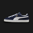 PUMA Suede Classic Unisex sneakers in PUMA Navy and PUMA White (399781_03). Features a premium deep navy suede upper with a crisp white leather Formstrip and metallic gold foil PUMA branding. Finished with the signature textured white rubber outsole. A 1968 archival icon. Luxuntique offers 100% authentic PUMA in Sri Lanka.