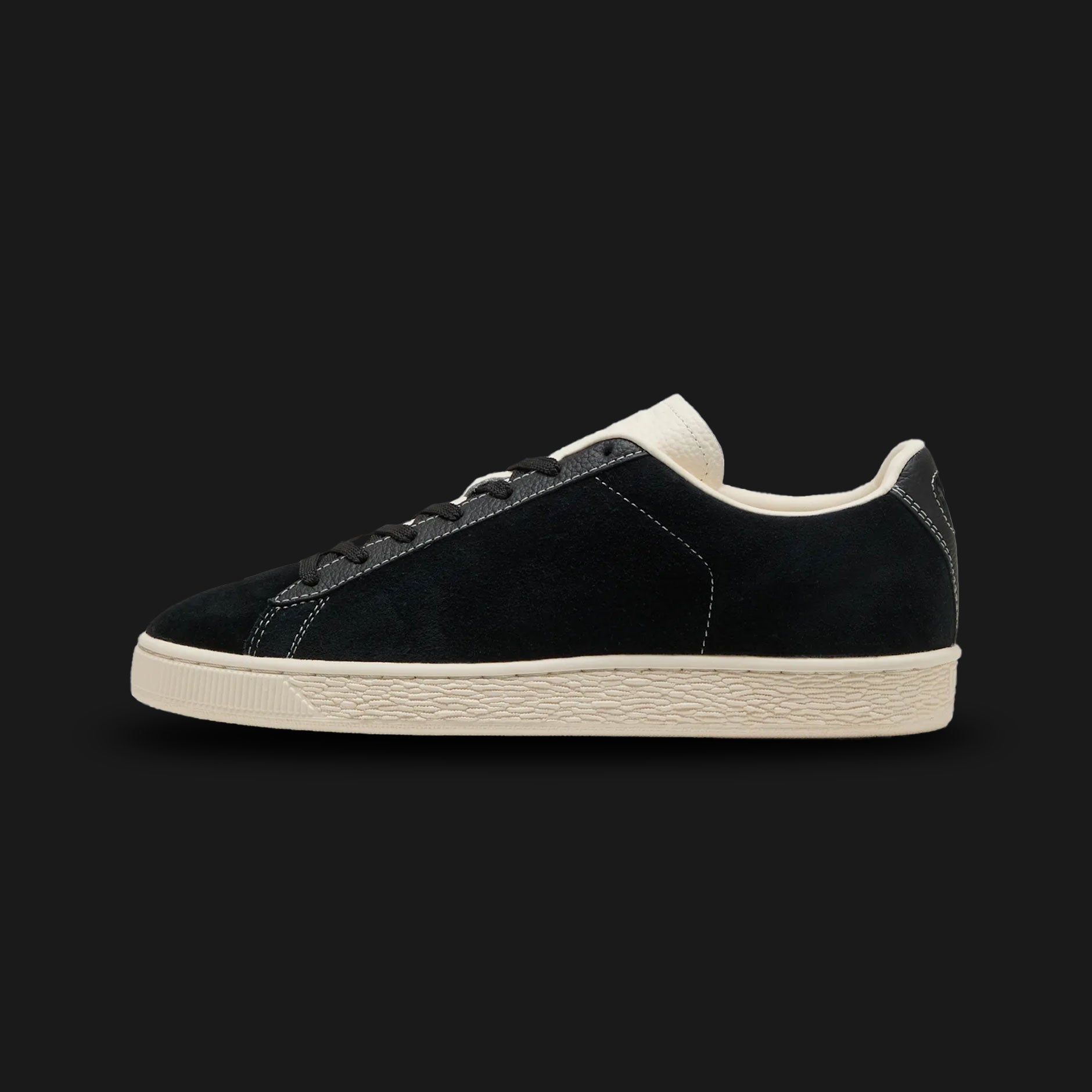 Puma Suede Icons unisex sneakers in Puma Black and Frosted Ivory (405345_01). Features a classic low-top vintage silhouette with a premium Puma Black suede upper and a contrasting Frosted Ivory Puma formstrip. Includes flat laces, iconic gold-foil Puma branding, and a durable retro rubber cupsole. Luxuntique guarantees 100% authentic Puma footwear in Sri Lanka.