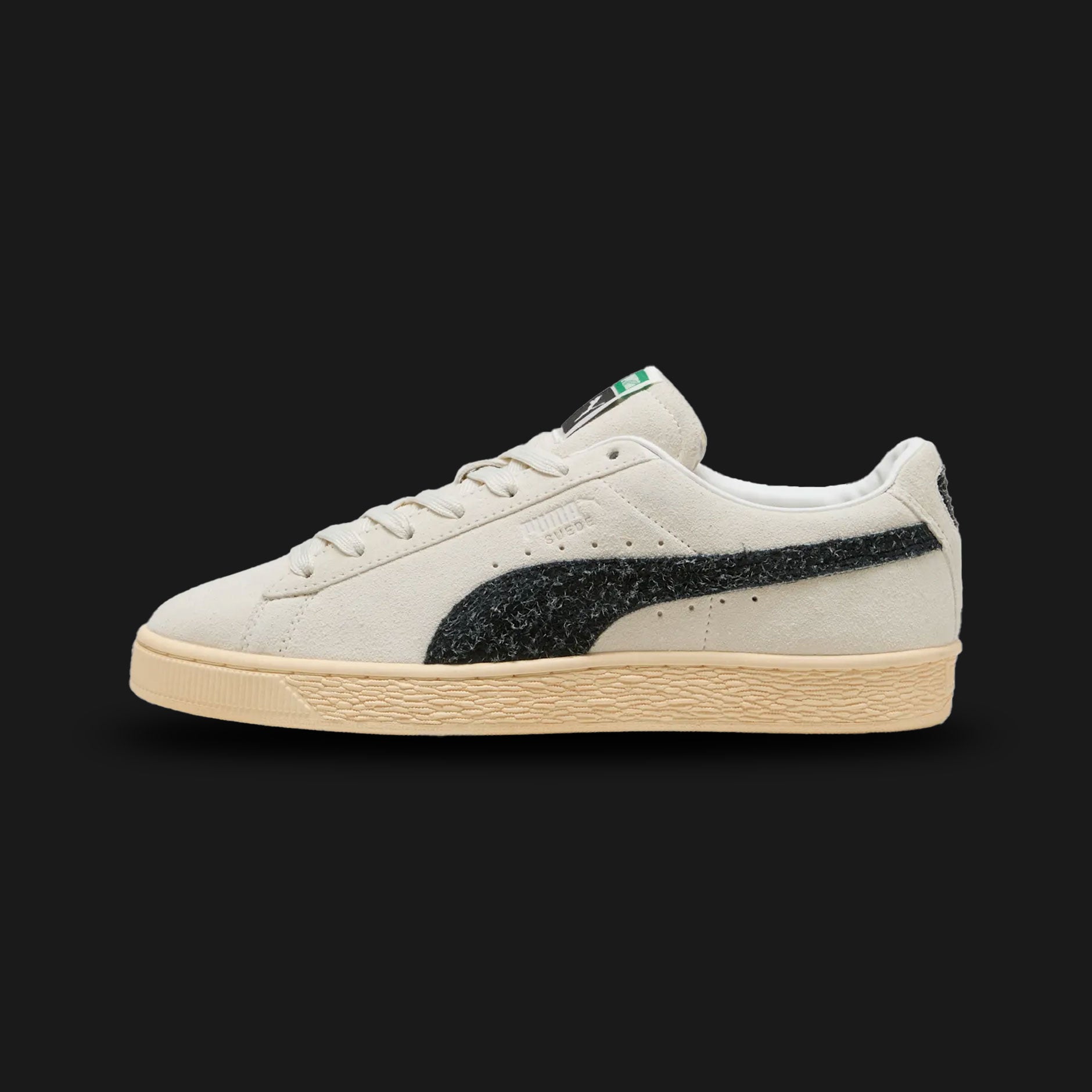 Puma Suede The NeverWorn VI unisex sneakers in Vapor Gray and Puma Black (403690_01). Features a nostalgic retro aesthetic with a premium Vapor Gray cow suede upper and classic Puma Black formstrip. Includes worn-in vintage details, an OrthoLite insole for comfort, and a flat rubber outsole for authentic street style. Luxuntique guarantees 100% authentic Puma footwear in Sri Lanka.