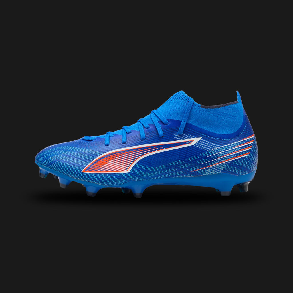 Puma Ultra 6 Match+ FG/AG unisex football boots in Ultra Blue, Puma White, and Puma Black (108524_01). Features a lightweight mesh upper with GripControl skin for superior high-speed ball control. Includes an adaptive high-cut knitted collar for ankle support, sharp Puma White branding, and a reactive SPEEDPLATE TPU outsole for explosive traction on Firm Ground and Artificial Ground. Luxuntique guarantees 100% authentic Puma footwear in Sri Lanka.