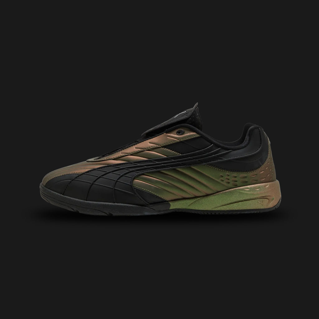 Puma V-S2 Spectrum unisex sneakers in PUMA Black, Iridescent, and Green (404356_02). Features a modern, low-profile silhouette with a bold black base and eye-catching iridescent panels that shift color with movement. Includes a vibrant green detailing, a durable synthetic upper, and a flat rubber outsole for optimal street-ready grip. Luxuntique guarantees 100% authentic Puma footwear in Sri Lanka.