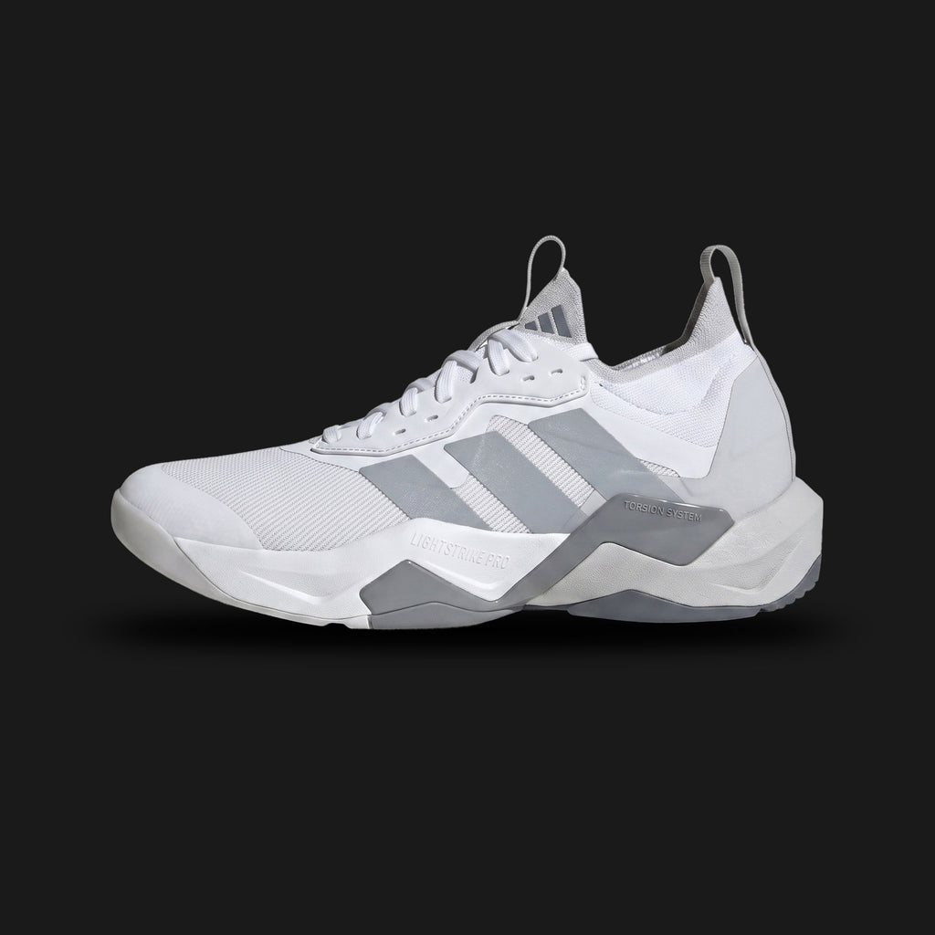 Rapidmove ADV 2 HIIT training shoes in Cloud White, Halo Silver, and Grey (JI4196). Features a breathable knit mesh upper, dynamic lacing support, responsive Lightstrike cushioning midsole, and Continental rubber outsole. Luxuntique guarantees 100% authentic footwear.