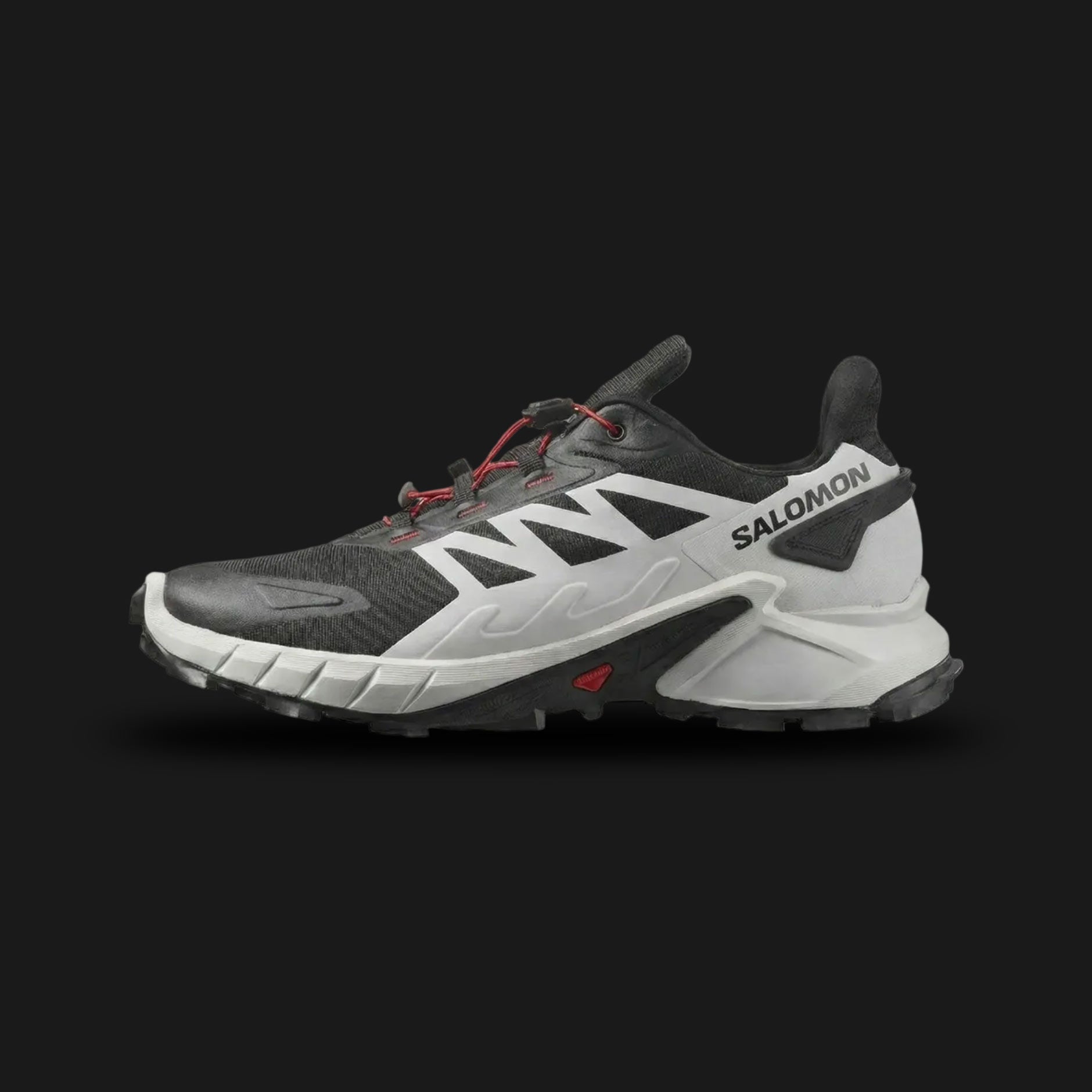 Salomon Supercross 4 men's trail running shoes in Black, White, and Fiery Red (Design Code: L41736600). Featuring an extra-grippy Mud Contagrip outsole with deep 5mm lugs, a powerful Fuze Foam midsole for eco-friendly cushioning, and a SensiFit wrap for a secure hold. Luxuntique offers 100% authentic Salomon trail sneakers at the lowest price in Sri Lanka.