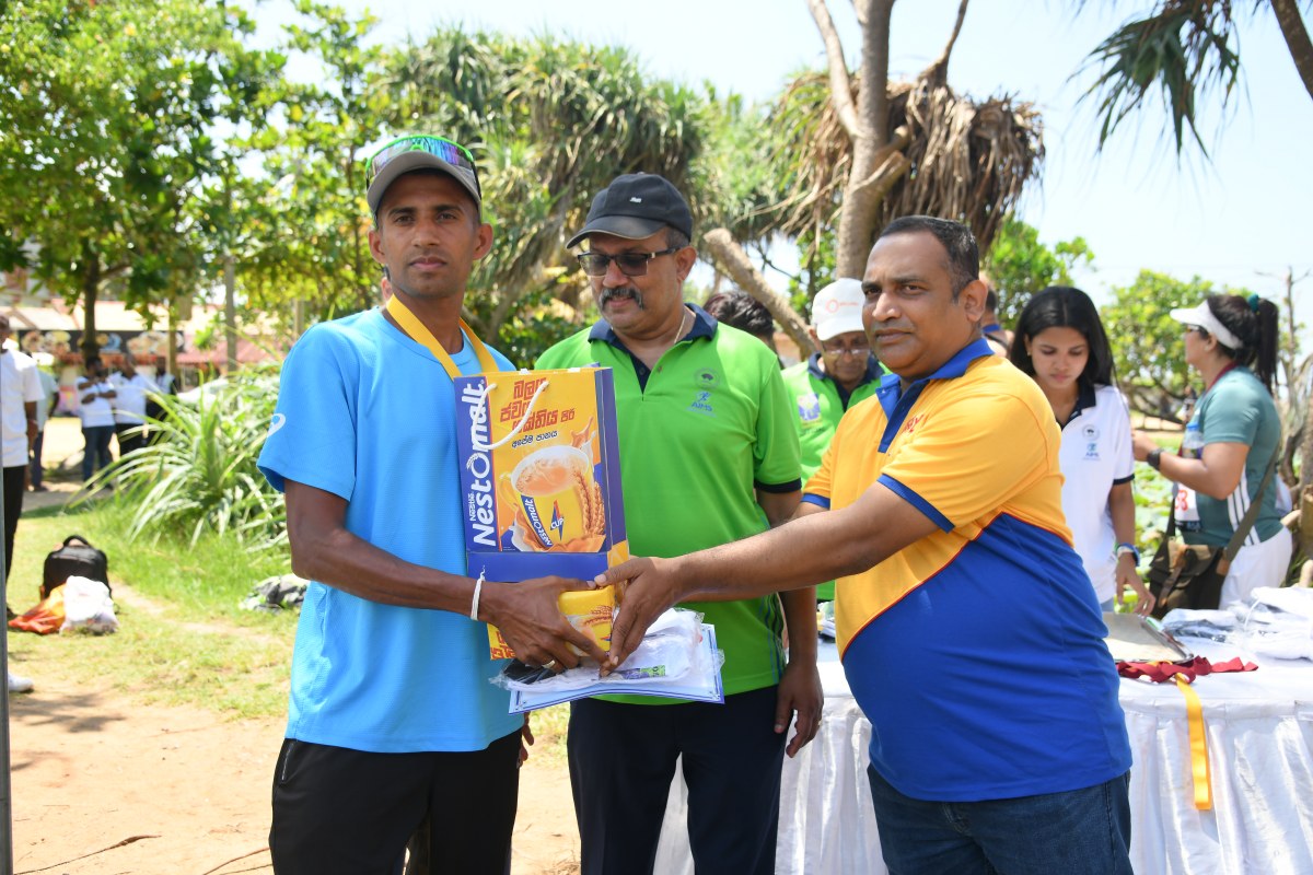 Udara Chanaka Rupasinghe receiving his prizes at the LSR Colombo Marathon 2026 prize-giving